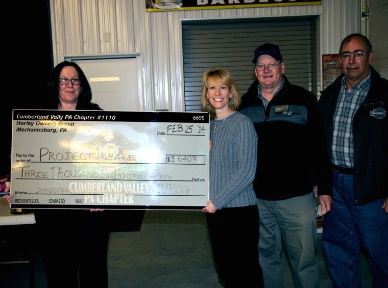 Benevolent bikers donate to Project SHARE
